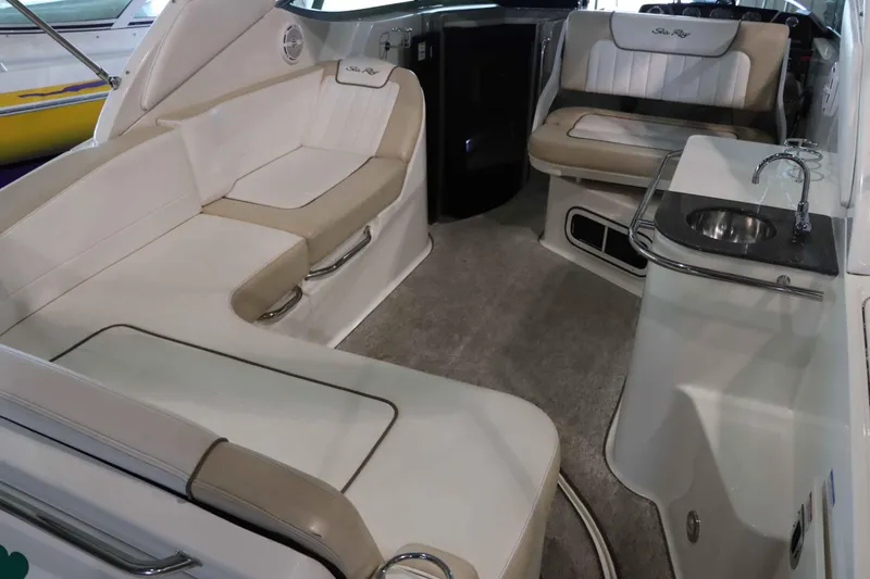 Slide: The Image of Interior of 2012 Sea Ray 280 Sundancer with seating and kitchenette. - 18