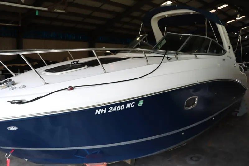 Slide: The Image of 2012 Sea Ray 280 Sundancer boat in a storage facility. - 2