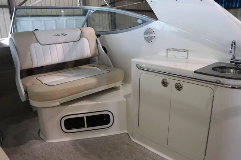 Slide: The Image of Interior of 2012 Sea Ray 280 Sundancer with seating and kitchenette area. - 20