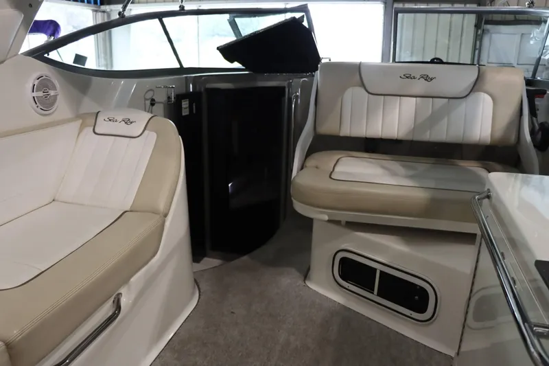 Slide: The Image of Interior of 2012 Sea Ray 280 Sundancer with beige seating and modern design. - 21
