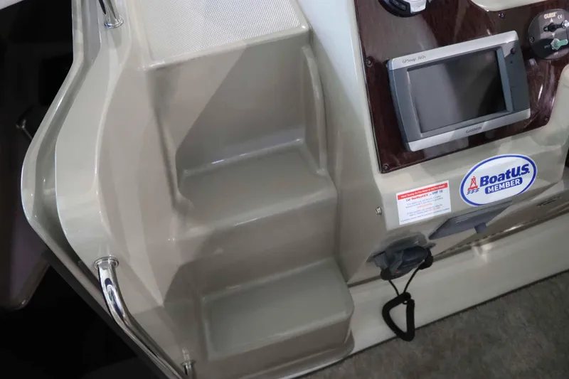 Slide: The Image of Interior view of 2012 Sea Ray 280 Sundancer with navigation system and BoatUS member sticker. - 22