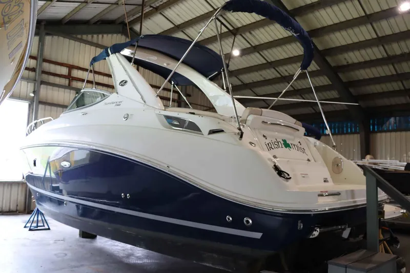 Slide: The Image of 2012 Sea Ray 280 Sundancer boat in a storage facility. - 3