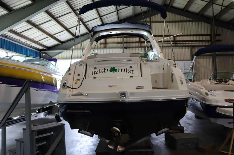 Slide: The Image of 2012 Sea Ray 280 Sundancer boat named "Irish Mist" in a storage facility. - 6