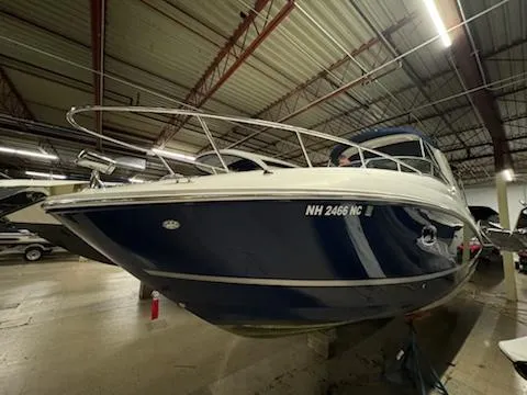 Slide: The Image of 2012 Sea Ray 280 Sundancer boat in indoor storage. - 8