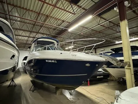 Slide: The Image of 2012 Sea Ray 280 Sundancer boat in indoor storage facility. - 9