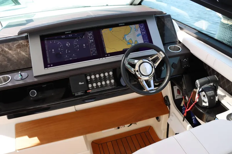 Slide: The Image of Sea Ray 400SLX 2020 helm with advanced navigation system and luxurious interior. - 15