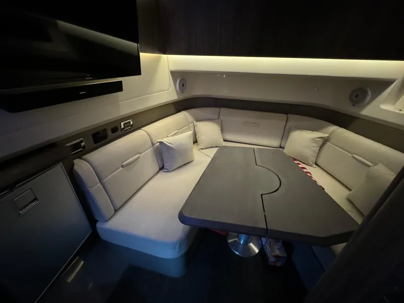 Slide: The Image of Interior of 2020 Sea Ray 400SLX with cozy seating and modern amenities. - 34