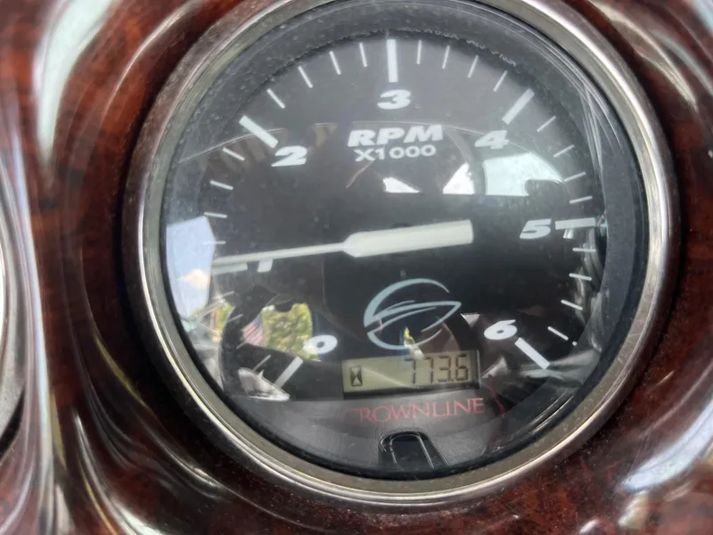 Slide: The Image of Close-up of 2004 Crownline 270BR boat tachometer showing 73.6 hours. - 11