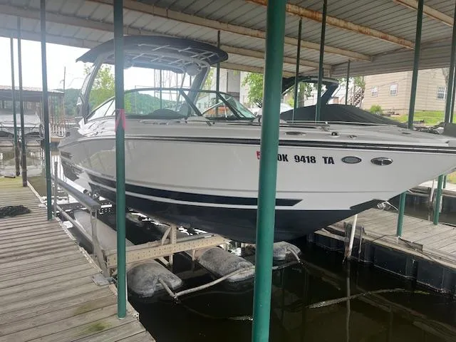 Slide: The Image of 2022 Monterey 298 Super Sport boat docked in a covered marina. - 3