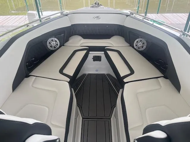 Slide: The Image of 2022 Monterey 298 Super Sport boat interior with white and black seating. - 9