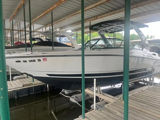 The Image of 2022 Monterey 298 Super Sport boat docked in a covered marina. - 0