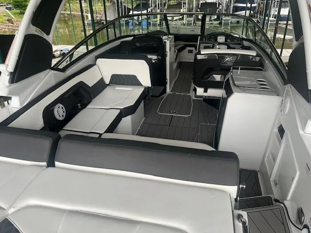 Slide: The Image of 2022 Monterey 298 Super Sport boat interior with seating and dashboard. - 5