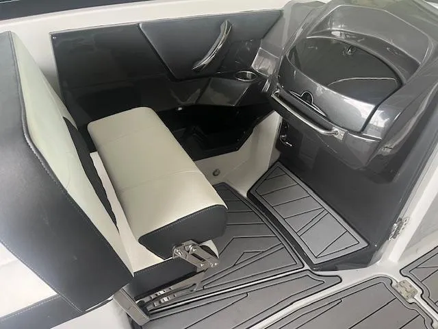Slide: The Image of 2022 Monterey 298 Super Sport boat interior with black and white seating. - 8