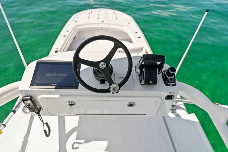 Slide: The Image of 2023 Barker Boatworks 40 HPC helm with Garmin navigation system. - 26