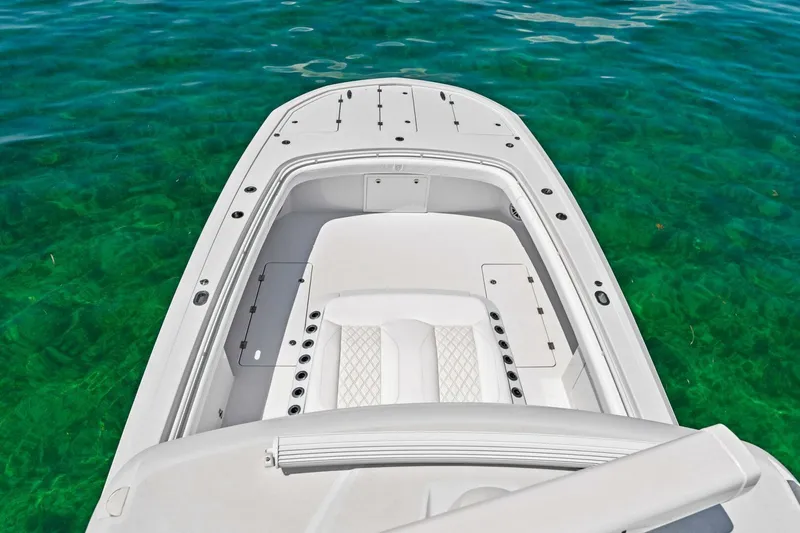 Slide: The Image of 2023 Barker Boatworks 40 HPC on clear turquoise water. - 27