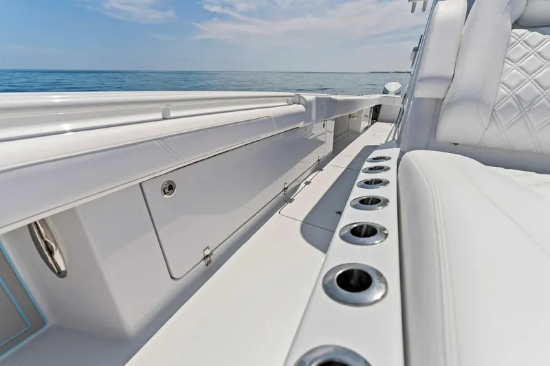 Slide: The Image of 2023 Barker Boatworks 40 HPC interior with rod holders and ocean view. - 14