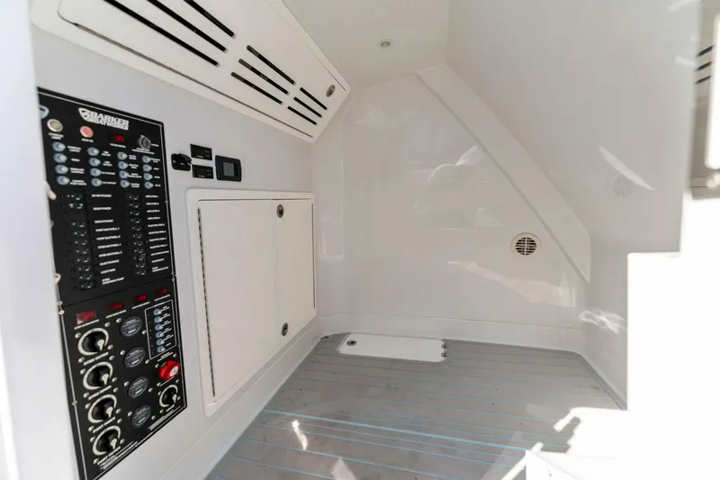 Slide: The Image of Interior control panel of 2023 Barker Boatworks 40 HPC, featuring modern electrical systems. - 15