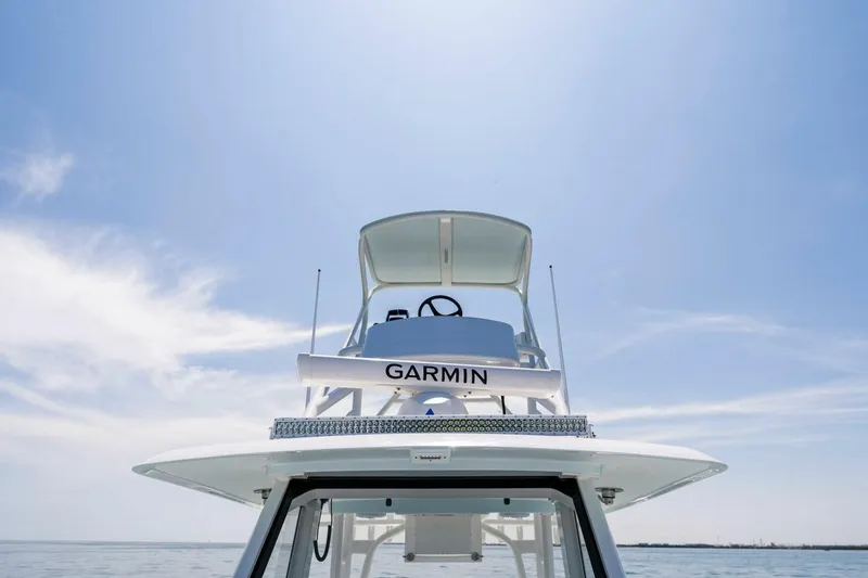 Slide: The Image of 2023 Barker Boatworks 40 HPC with Garmin navigation system under clear sky. - 24