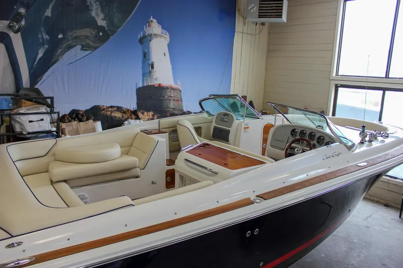 Slide: The Image of 2004 Chris-Craft 28 Launch boat interior with lighthouse mural background. - 2