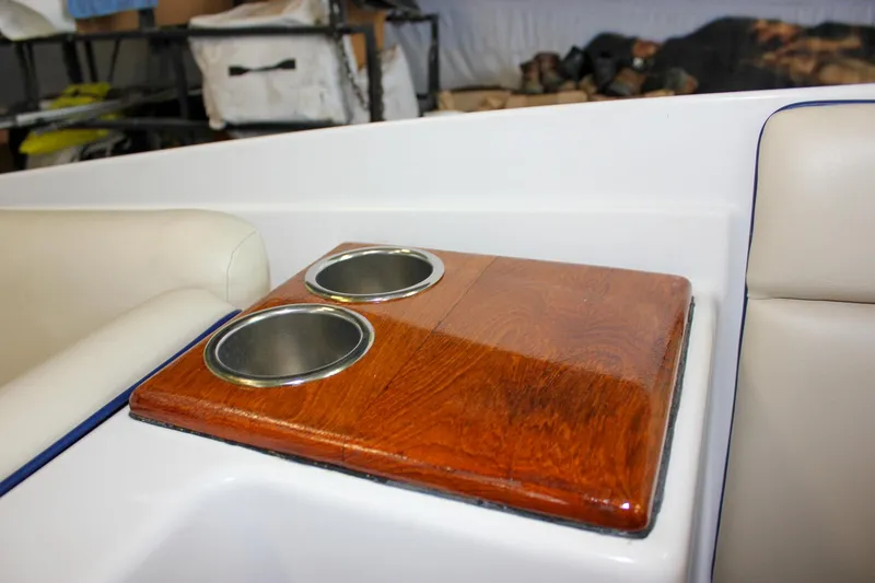 Slide: The Image of 2004 Chris-Craft 28 LAUNCH boat interior with wooden cup holders. - 21