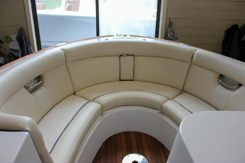 Slide: The Image of Luxurious seating area on 2004 Chris-Craft 28 Launch boat with elegant wood flooring. - 29