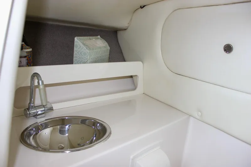 Slide: The Image of 2004 Chris-Craft 28 Launch interior with sink and storage area. - 39