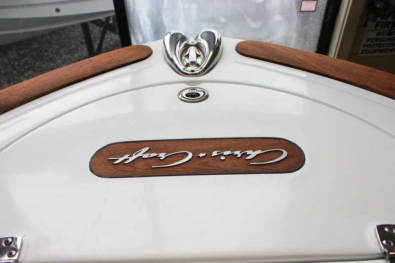 Slide: The Image of 2004 Chris-Craft 28 Launch boat with wood accents and logo detail. - 41