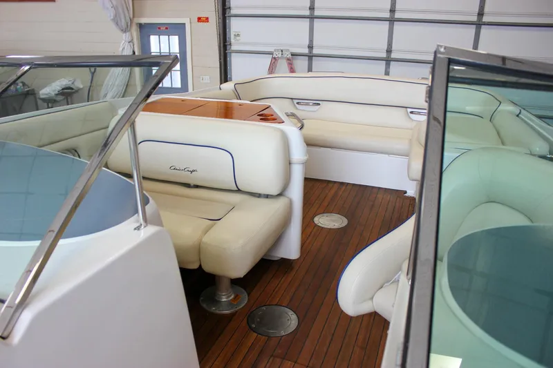 Slide: The Image of Interior of 2004 Chris-Craft 28 Launch boat with elegant seating and wooden flooring. - 42