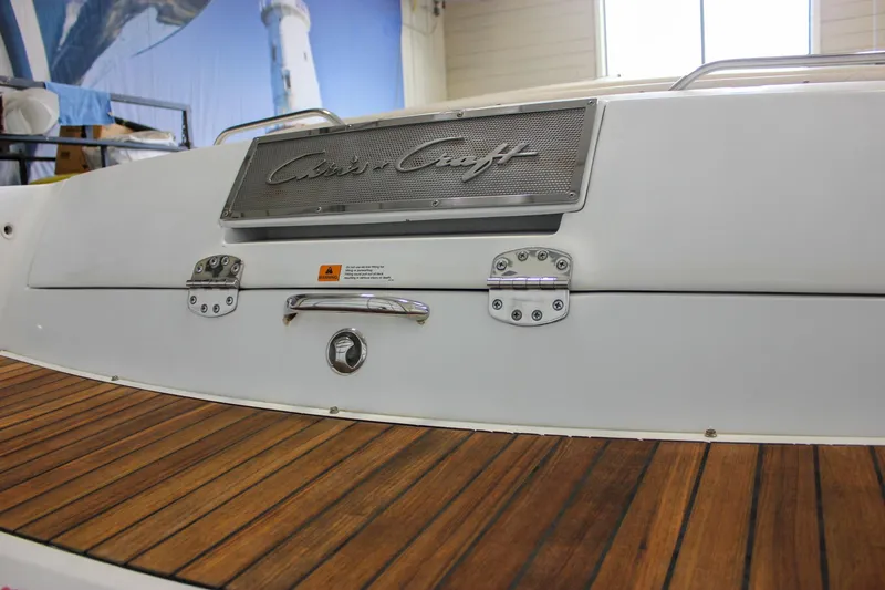 Slide: The Image of 2004 Chris-Craft 28 Launch boat with teak deck and branded metal plate. - 50
