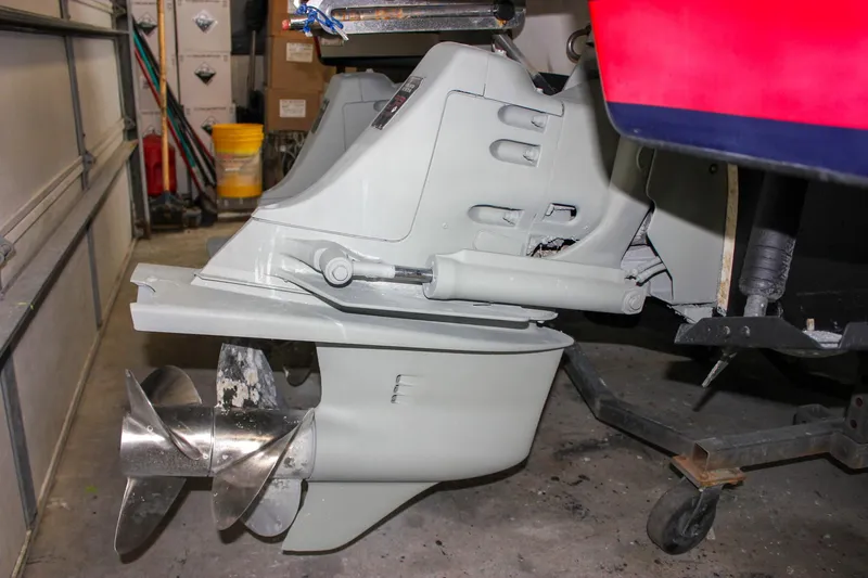 Slide: The Image of 2004 Chris-Craft 28 LAUNCH boat propeller and stern drive in a garage setting. - 6