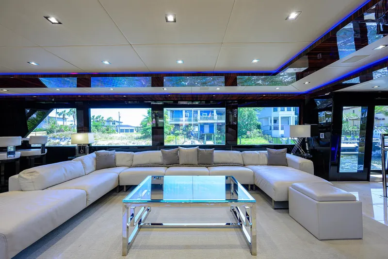 Slide: The Image of Luxurious interior of 1997 Broward 108 Raised Pilothouse yacht with modern furnishings. - 12