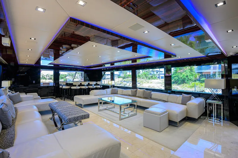Slide: The Image of Luxurious interior of 1997 Broward 108 Raised Pilothouse yacht with modern furnishings. - 17