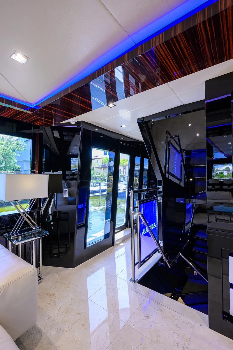 Slide: The Image of Luxurious interior of 1997 Broward 108 Raised Pilothouse yacht with modern decor. - 19