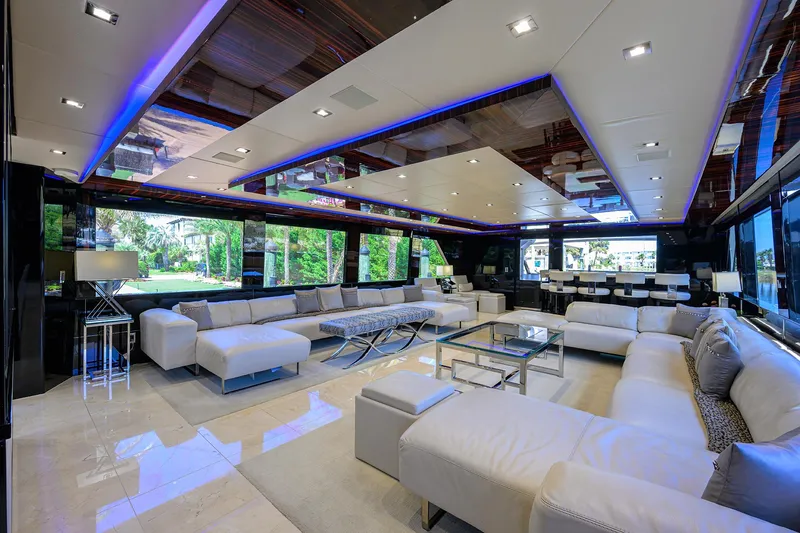 Slide: The Image of Luxurious interior of 1997 Broward 108 Raised Pilothouse yacht with modern furnishings. - 21