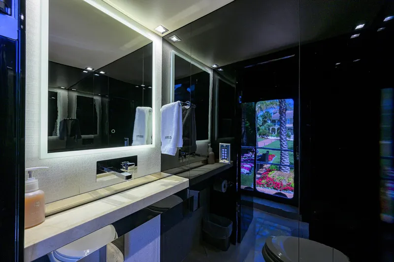 Slide: The Image of Luxurious bathroom on a 1997 Broward 108 Raised Pilothouse yacht with modern fixtures. - 28