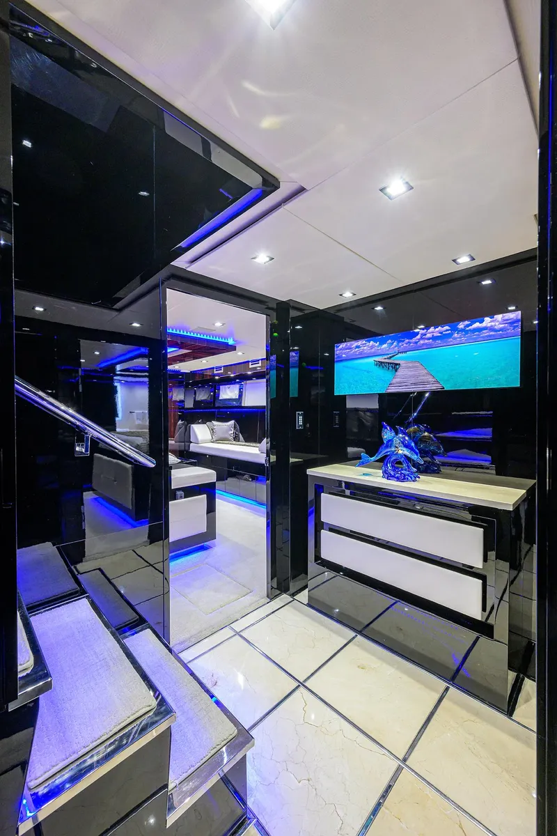 Slide: The Image of Luxurious interior of 1997 Broward 108 Raised Pilothouse yacht with modern decor and LED lighting. - 39