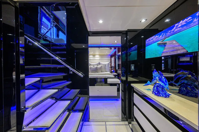 Slide: The Image of Luxurious interior of 1997 Broward 108 Raised Pilothouse yacht with modern decor and blue lighting. - 40