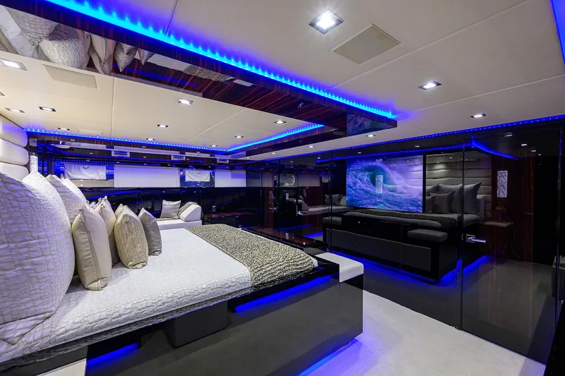 Slide: The Image of Luxurious interior of 1997 Broward 108 Raised Pilothouse yacht with modern lighting. - 43