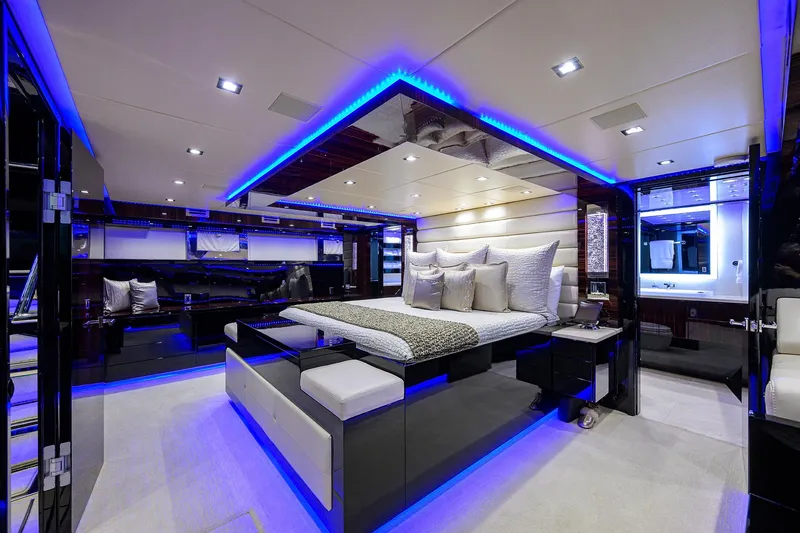 Slide: The Image of Luxurious master bedroom on 1997 Broward 108 Raised Pilothouse yacht with modern LED lighting. - 47