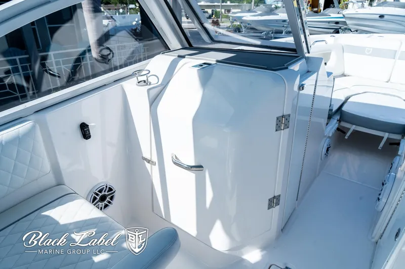 Slide: The Image of 2024 Sea Fox 288 Traveler Dual Console interior with seating and storage. - 10