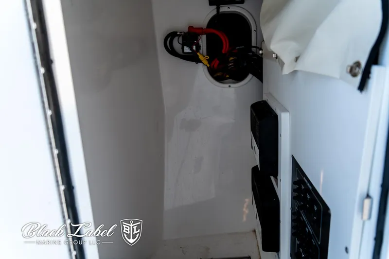 Slide: The Image of 2024 Sea Fox 288 Traveler Dual Console interior compartment with wiring and controls. - 13