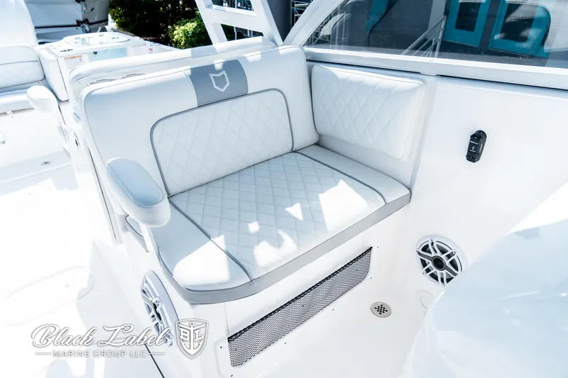 Slide: The Image of 2024 Sea Fox 288 Traveler Dual Console boat with luxurious white seating and modern design. - 15