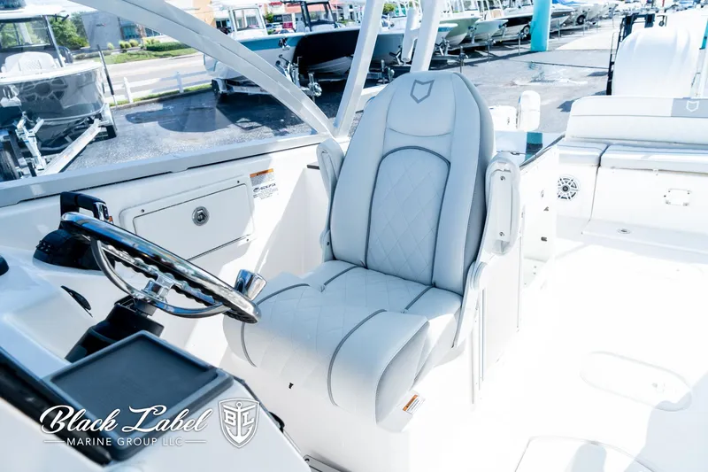 Slide: The Image of 2024 Sea Fox 288 Traveler Dual Console interior with luxurious seating and steering wheel. - 17