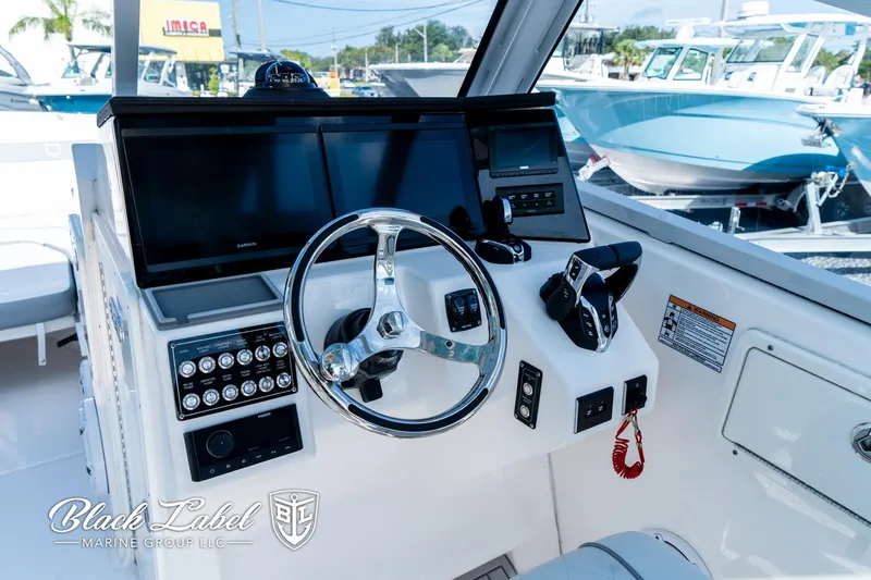 Slide: The Image of 2024 Sea Fox 288 Traveler Dual Console helm with modern controls and displays. - 18