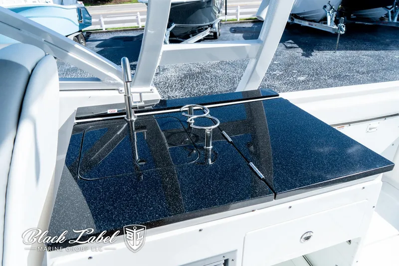 Slide: The Image of 2024 Sea Fox 288 Traveler Dual Console boat interior with sleek countertop and sink. - 24