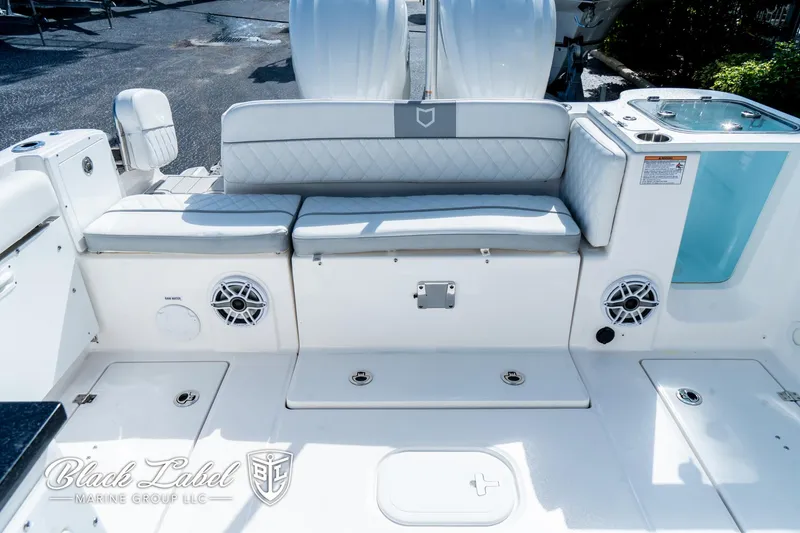 Slide: The Image of 2024 Sea Fox 288 Traveler Dual Console boat interior with seating and speakers. - 28