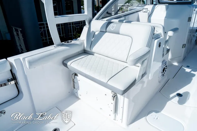 Slide: The Image of 2024 Sea Fox 288 Traveler Dual Console boat interior with white seating. - 29