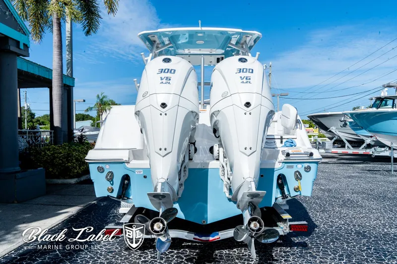Slide: The Image of 2024 Sea Fox 288 Traveler Dual Console with twin 300 V6 engines, docked outdoors. - 3