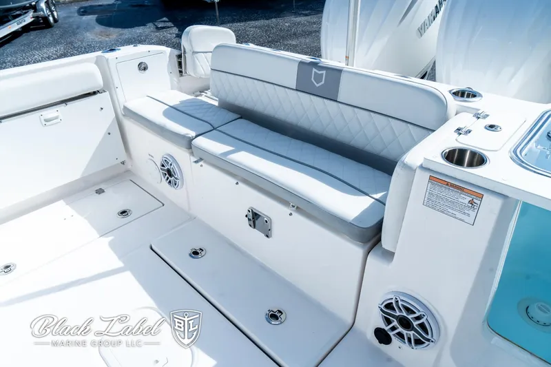 Slide: The Image of 2024 Sea Fox 288 Traveler Dual Console boat interior with seating and speakers. - 34