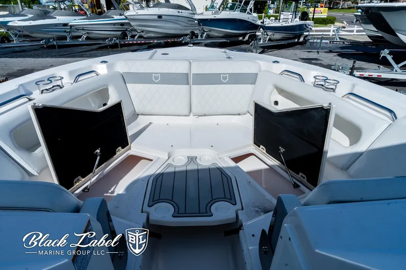 Slide: The Image of 2024 Sea Fox 288 Traveler Dual Console boat interior with open storage compartments. - 6